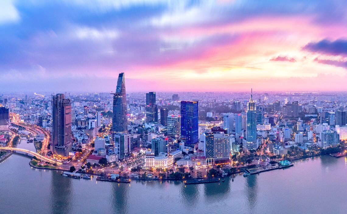 Vietnam: Aerial view during sunset of Ho Chi Minh City with many buildings in the foreground you can see the Saigon River Vietnam: Aerial view during sunset of Ho Chi Minh City with many buildings in the foreground you can see the Saigon River